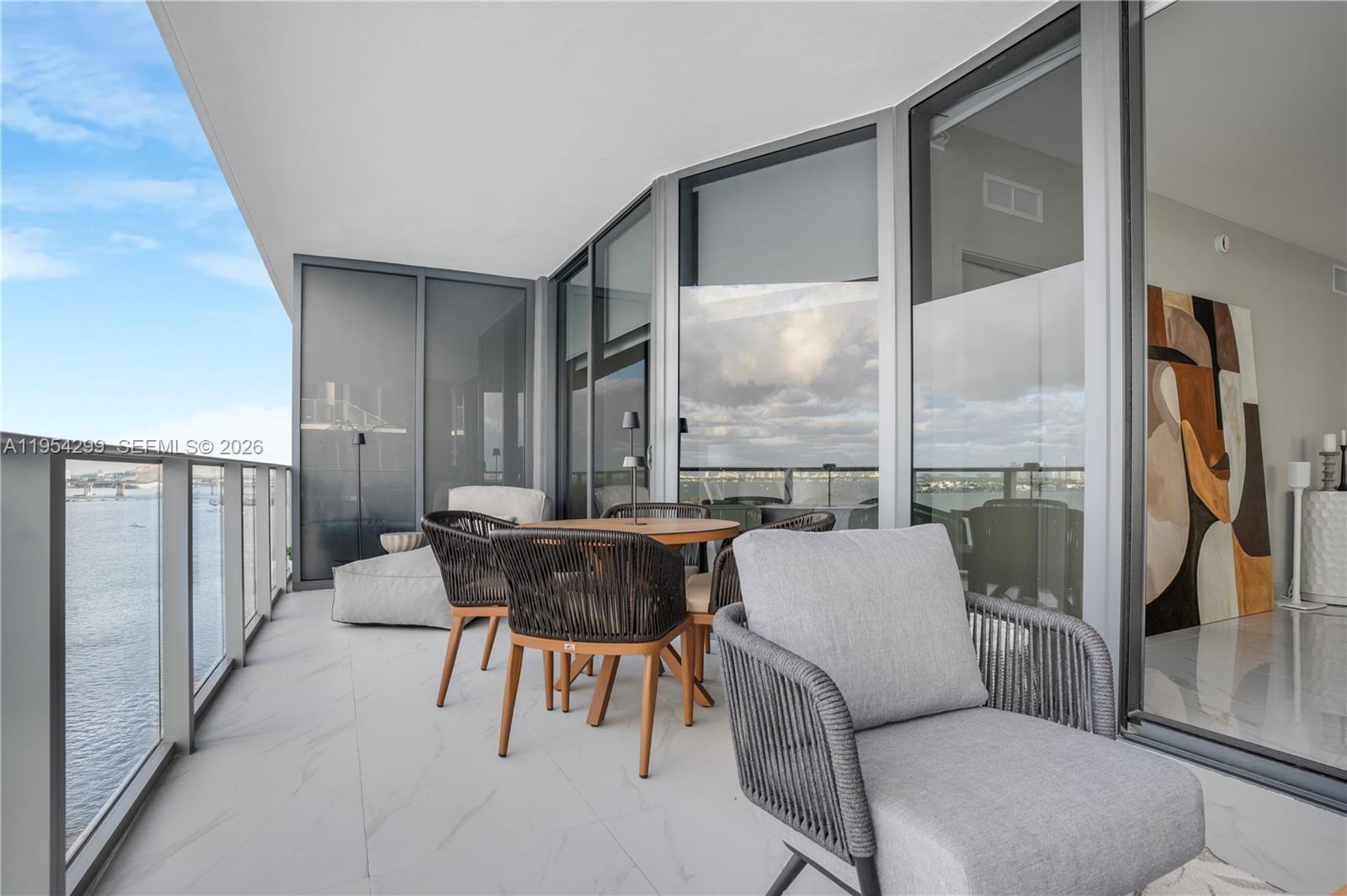 700 Northeast 24th Street, Unit 901 Miami, FL 33137 - Photo 16 of 59 a living room with furniture and a large window