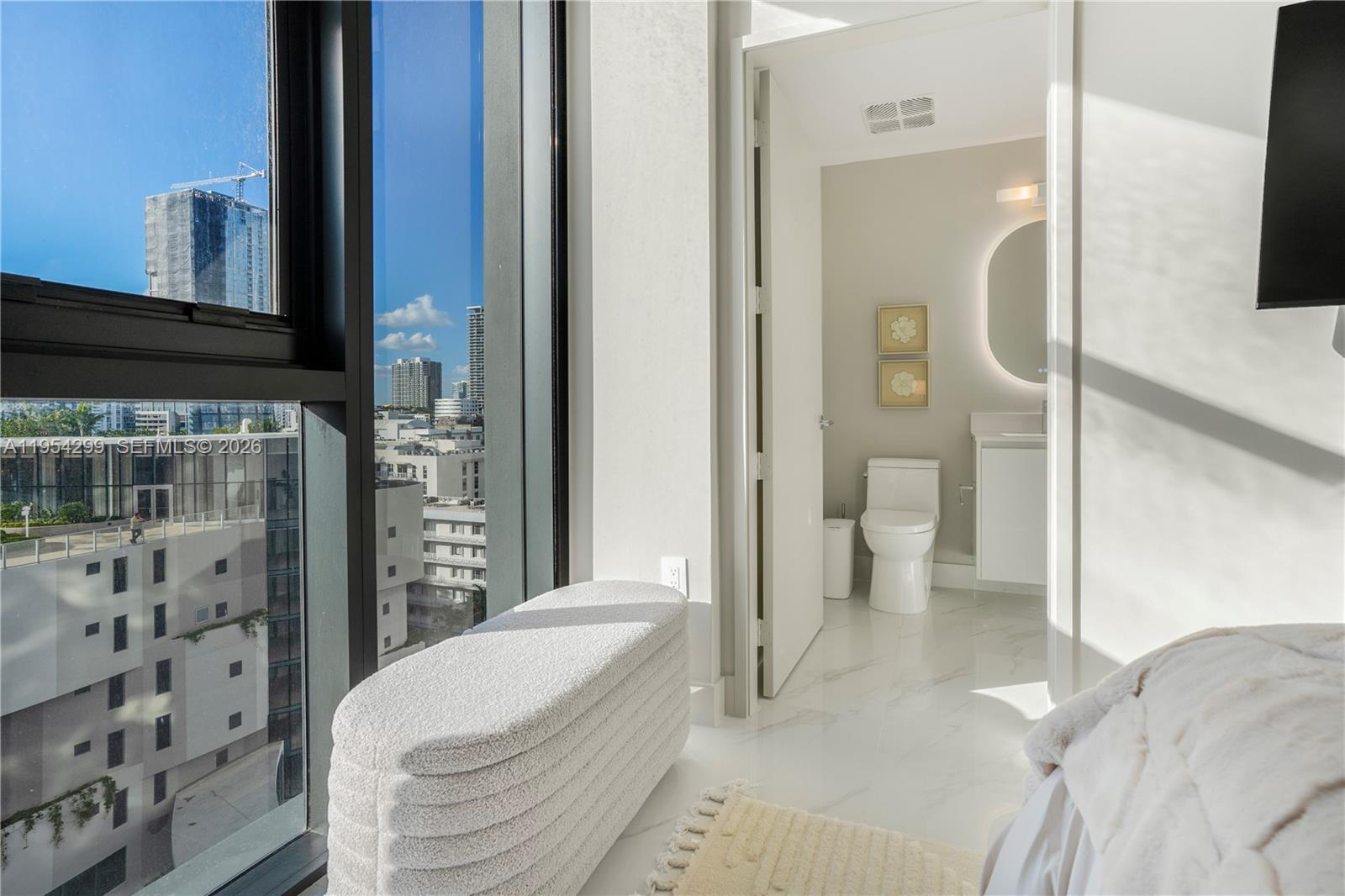 700 Northeast 24th Street, Unit 901 Miami, FL 33137 - Photo 55 of 59 a spacious bathroom with a bathtub and a shower