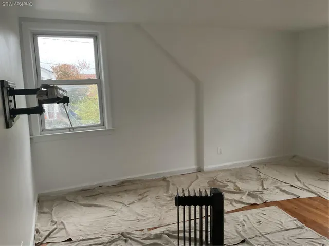 a view of an empty room and window