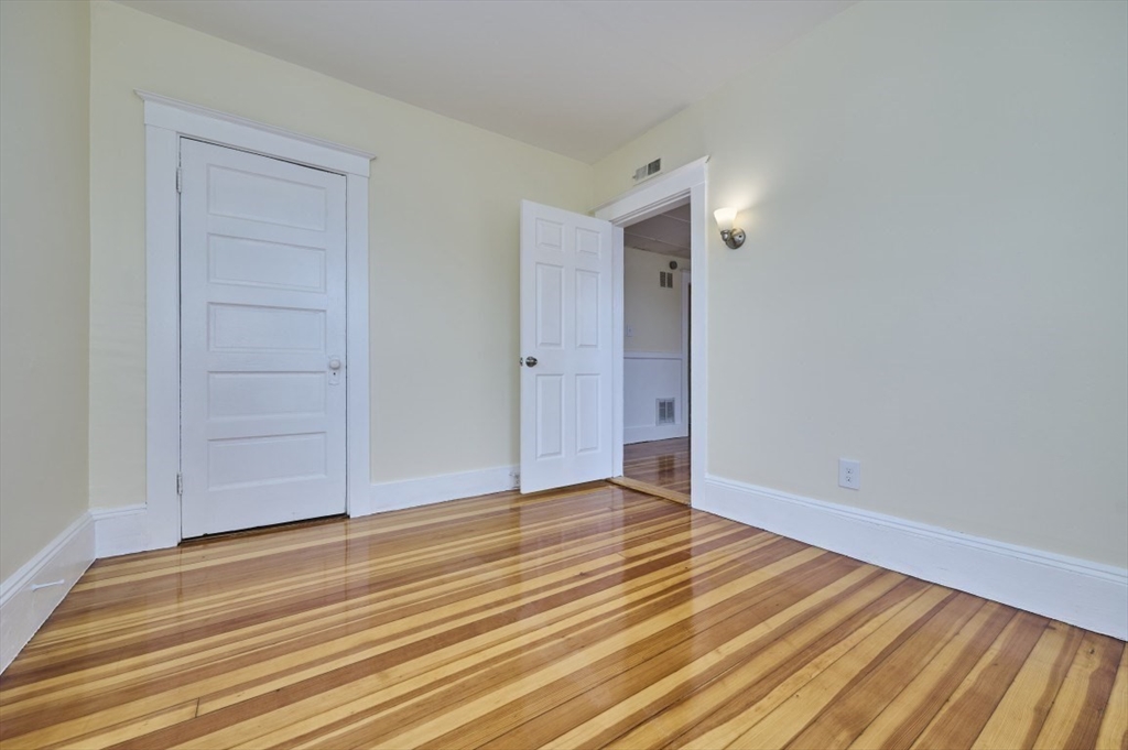 44 Park Street, Unit 3 Salem, MA 01970 - Photo 8 of 15 a view of an empty room with wooden floor and entryway
