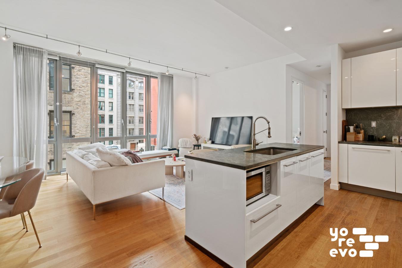 a view of kitchen with stainless steel appliances granite countertop a stove and a refrigerator