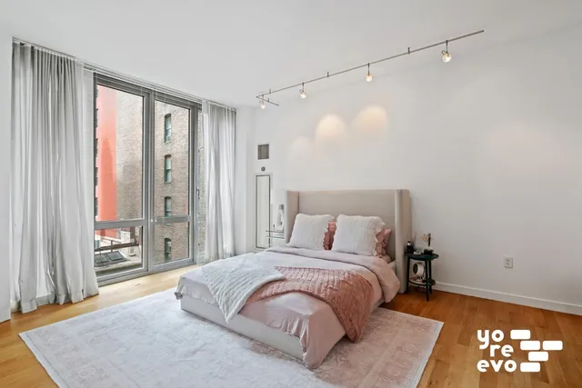 a kitchen with granite countertop a sink stainless steel appliances and cabinets