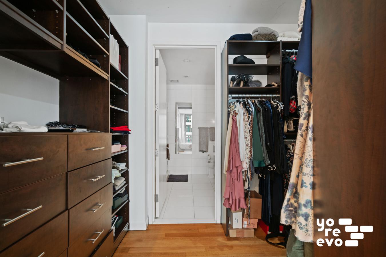 4 West 21st Street, Unit 7A Manhattan, NY 10010 - Photo 5 of 9 a view of walk in closet with clothes and shoes