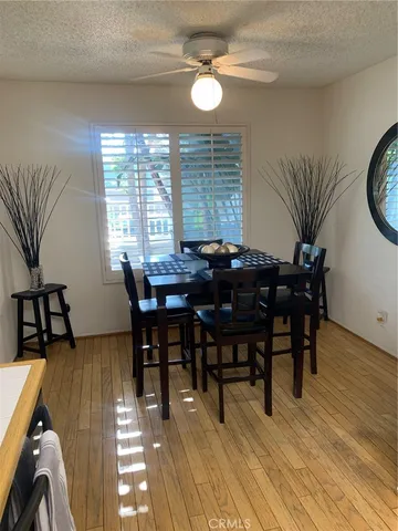 a view of a dining room with furniture window and wooden floor