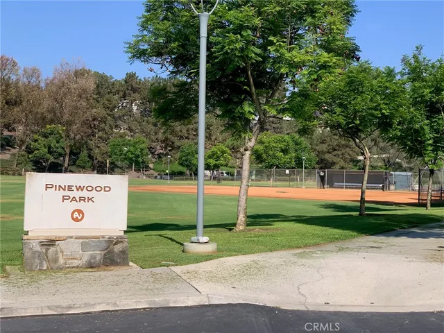 a view of a park with large trees