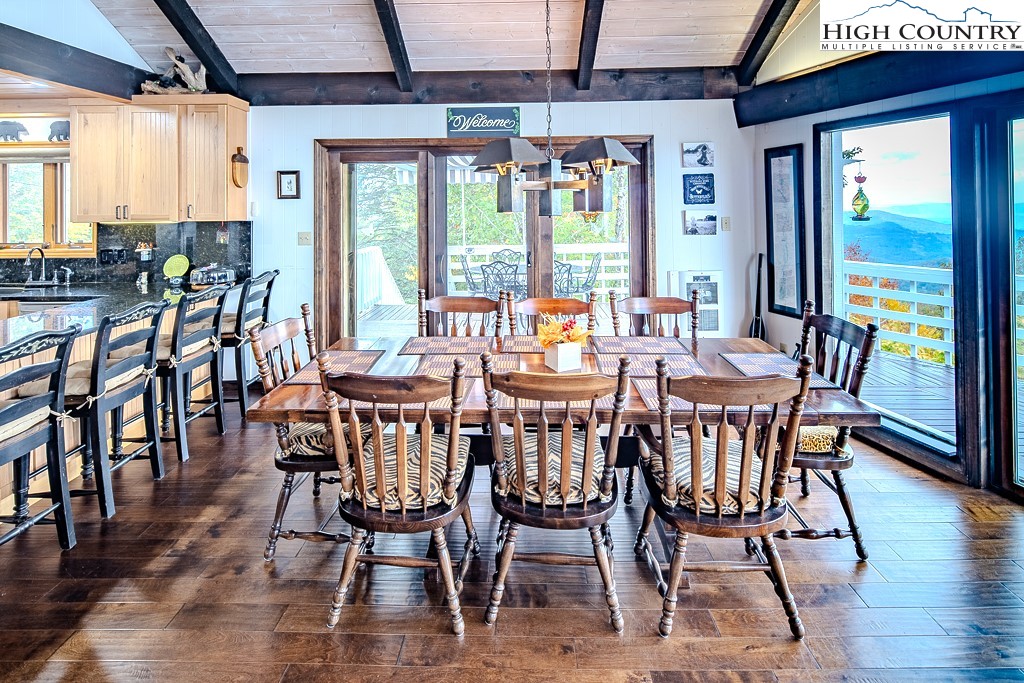 206 Pinnacle Ridge Road Beech Mountain, NC 28604 - Photo 10 of 41 a view of a dining room with furniture window and wooden floor