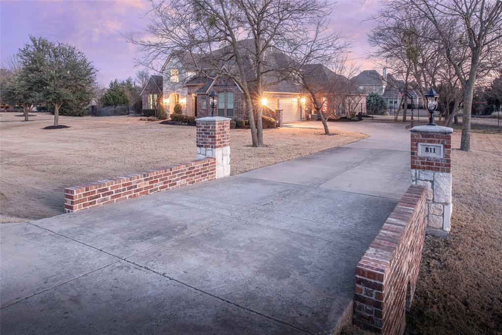811 Red Store Court Lucas, TX 75002 - Photo 2 of 31 a street view with large trees