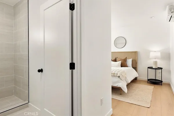 a bedroom with a bed and a lamp