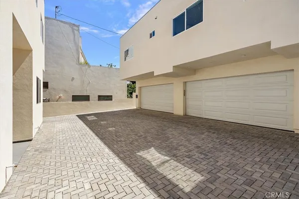 a view of a front door and a yard