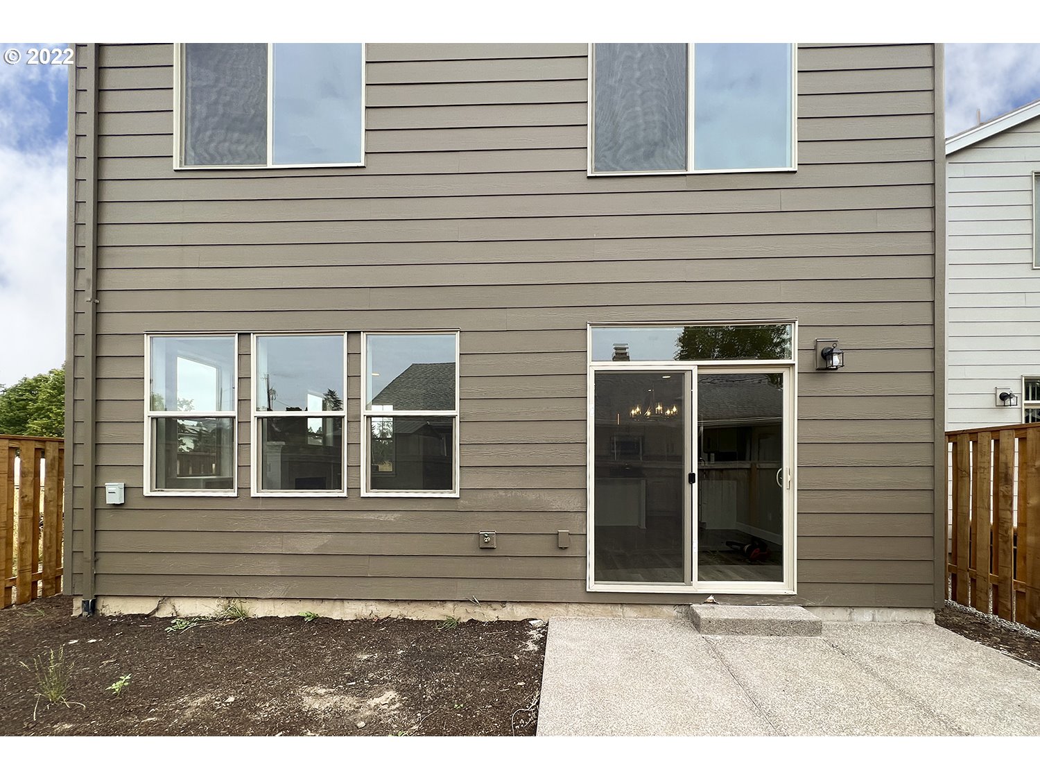 4791 Southwest 179th Avenue Beaverton, OR 97078 - Photo 2 of 27 a view of a house with a large window and wooden door