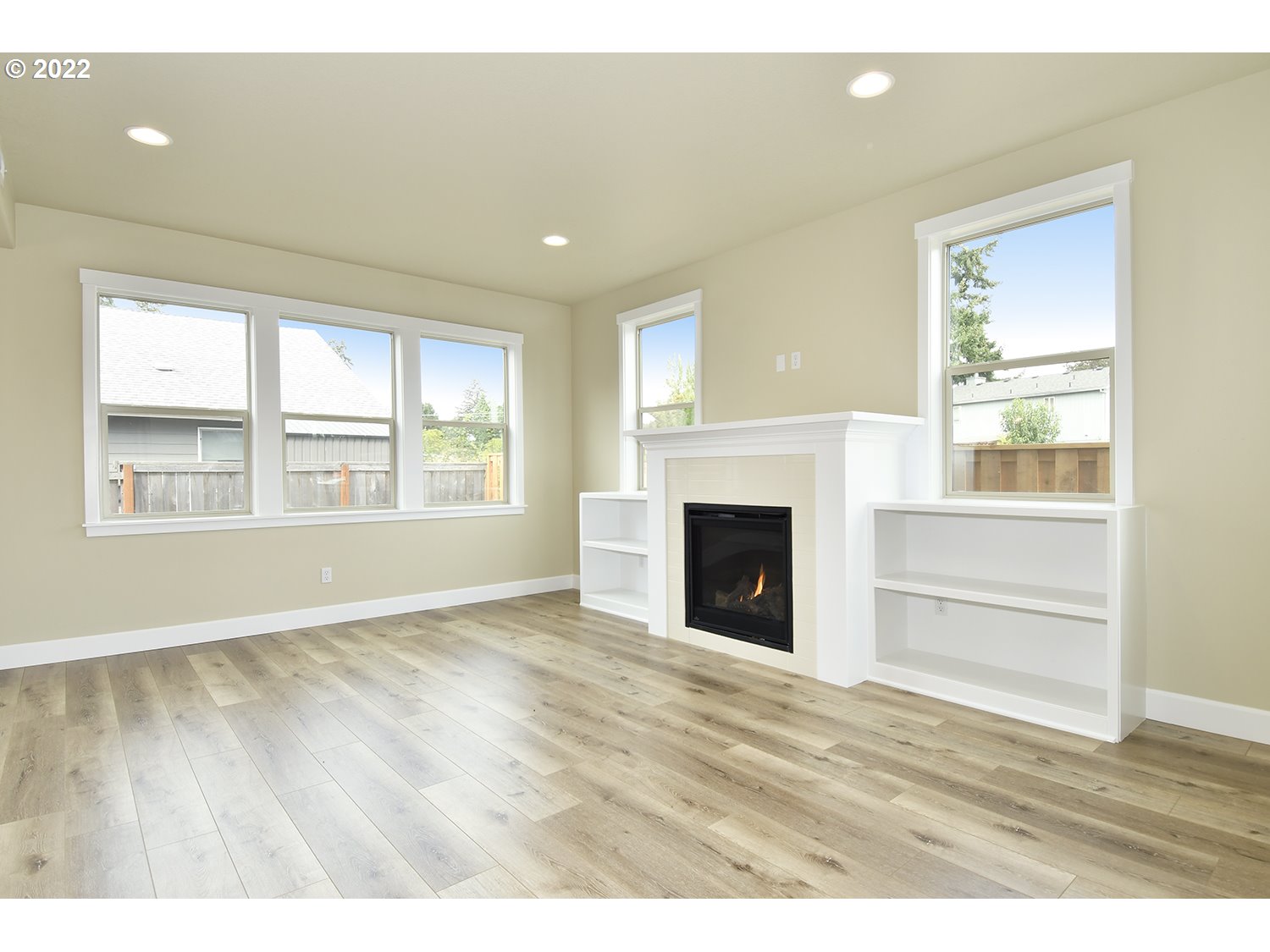 4791 Southwest 179th Avenue Beaverton, OR 97078 - Photo 4 of 27 a view of an empty room with wooden floor and a window