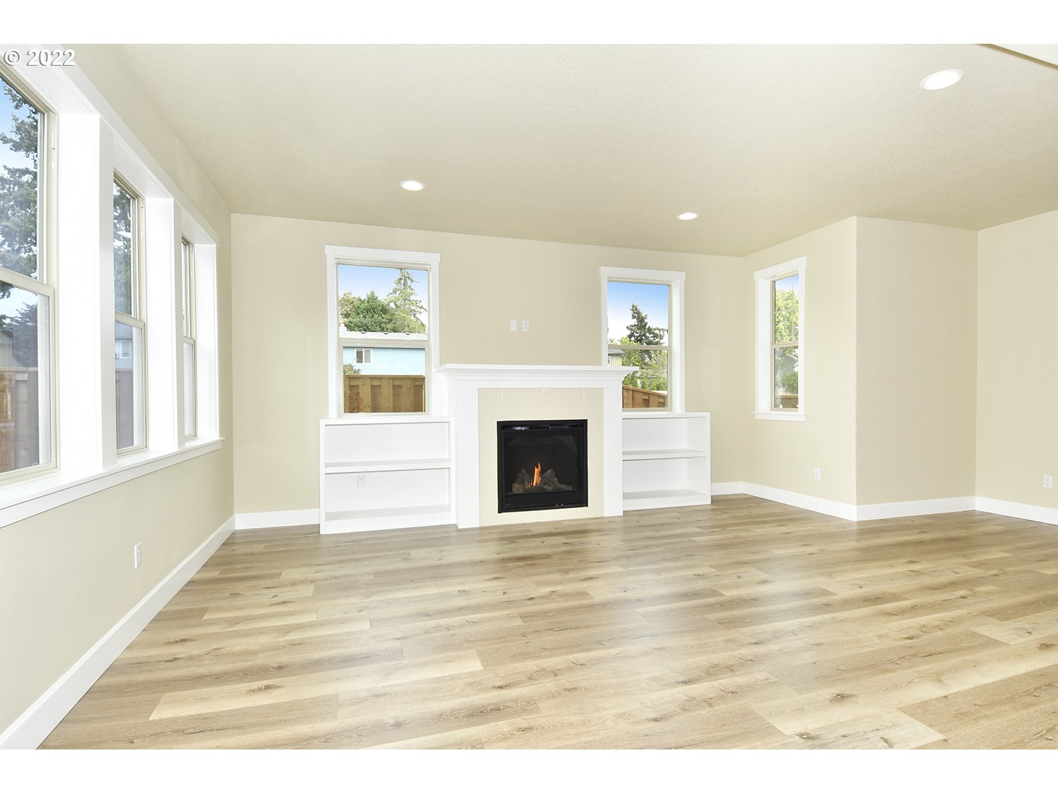 4791 Southwest 179th Avenue Beaverton, OR 97078 - Photo 5 of 27 a view of an empty room with wooden floor and a window