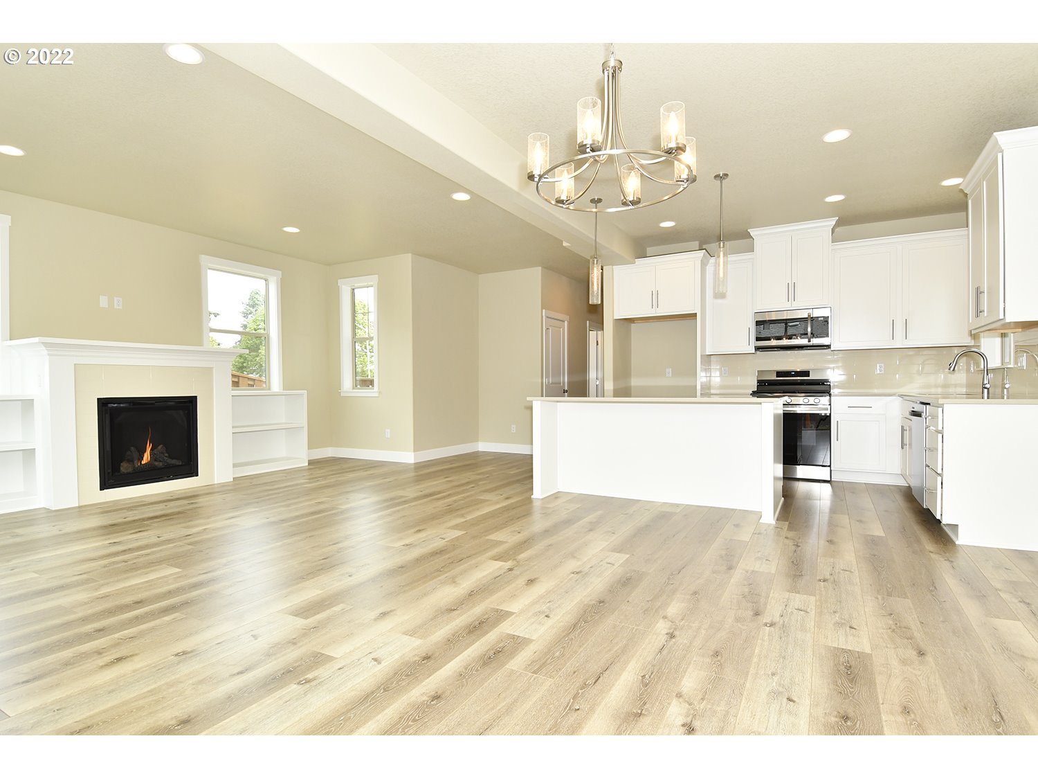 4791 Southwest 179th Avenue Beaverton, OR 97078 - Photo 8 of 27 a view of a kitchen with kitchen island wooden floor and stainless steel appliances