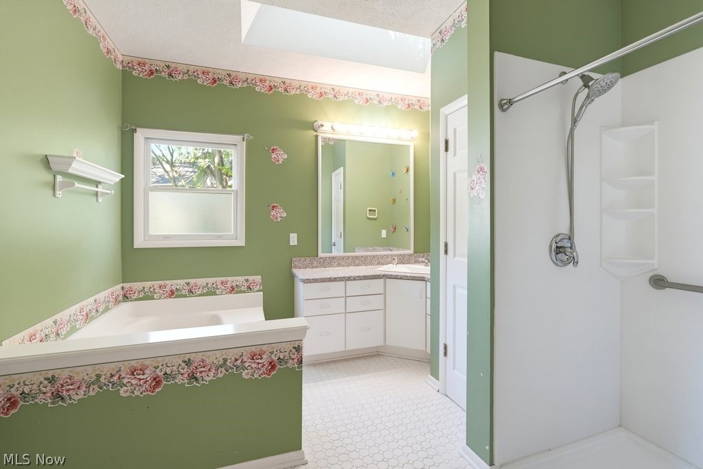 2331 Call Road Stow, OH 44224 - Photo 13 of 18 Owner's en suite bathroom features soaking tub, shower and a generous vanity with ample storage.