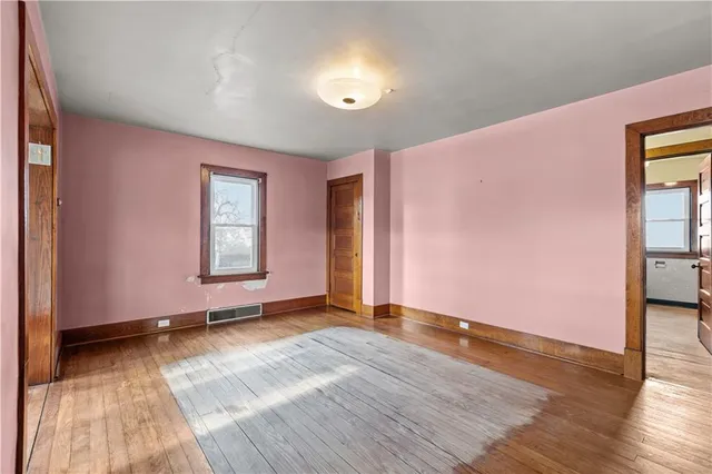 a view of an empty room and window