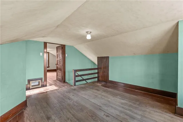 a view of room with window and hardwood