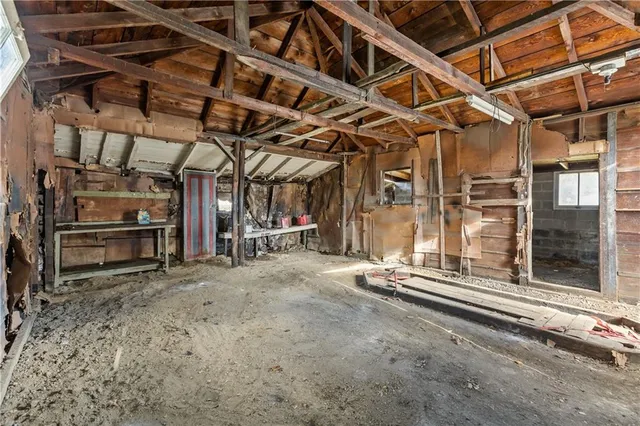 a view of a room with wooden walls