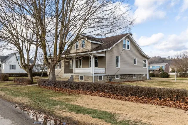 a front view of a house with a yard