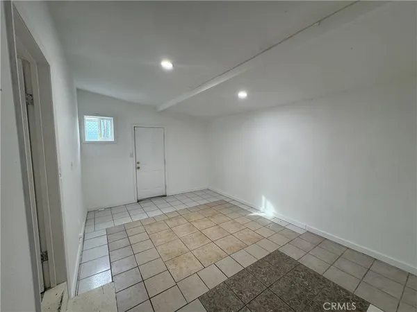 an empty room with white walls