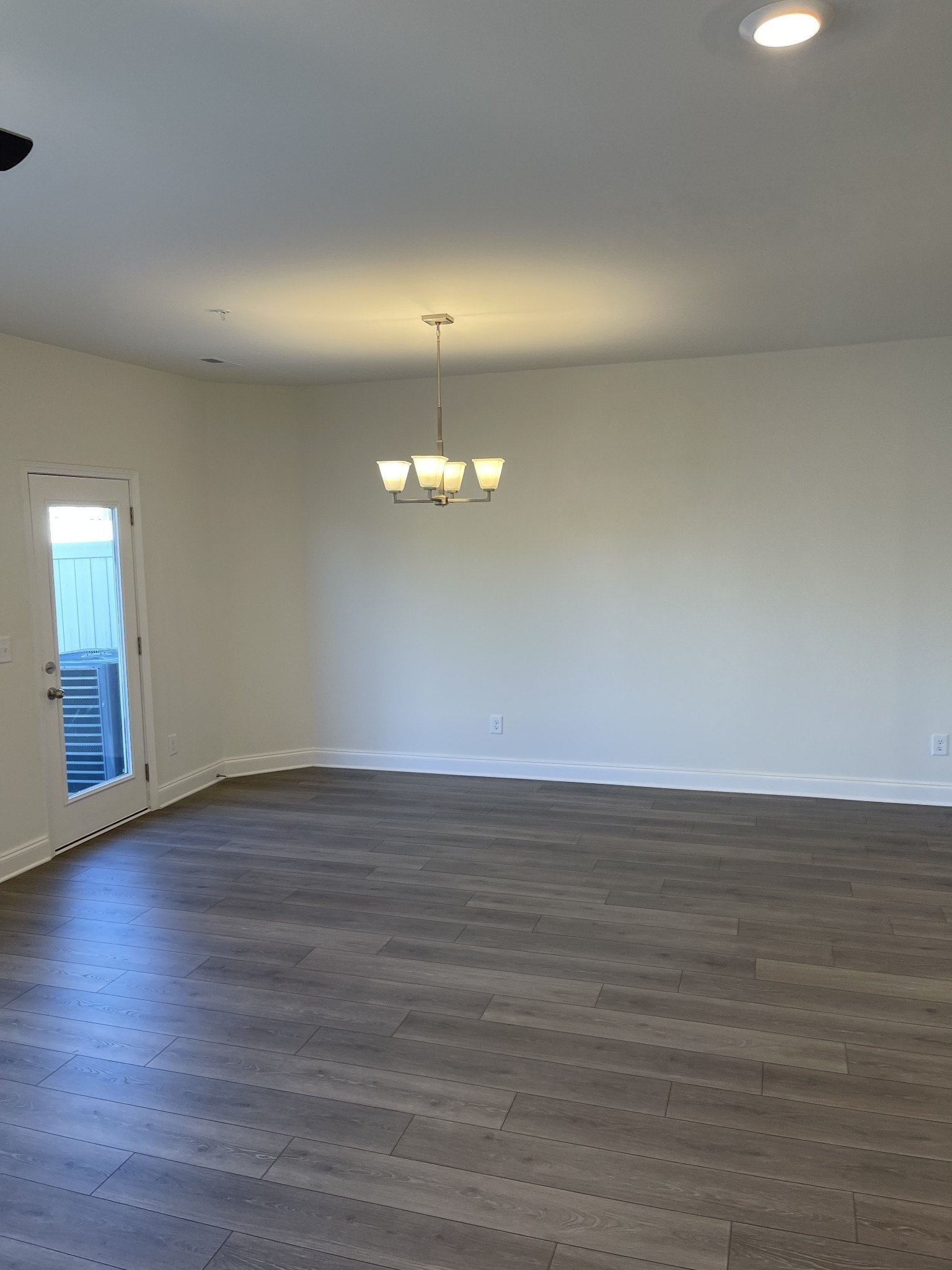 1203 June Wilde Ridge Spring Hill, TN 37174 - Photo 3 of 20 a view of an empty room with wooden floor