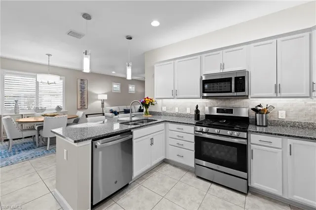 a bedroom with a bed dresser and a window