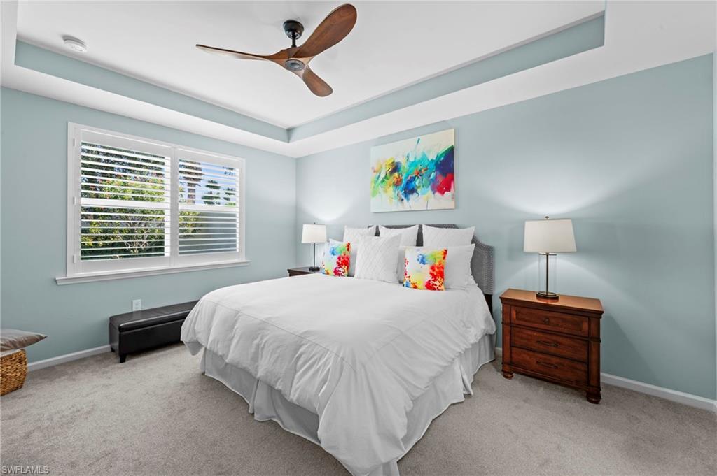 20179 Torch Key Way Estero, FL 33928 - Photo 18 of 41 a bedroom with a bed dresser and a window