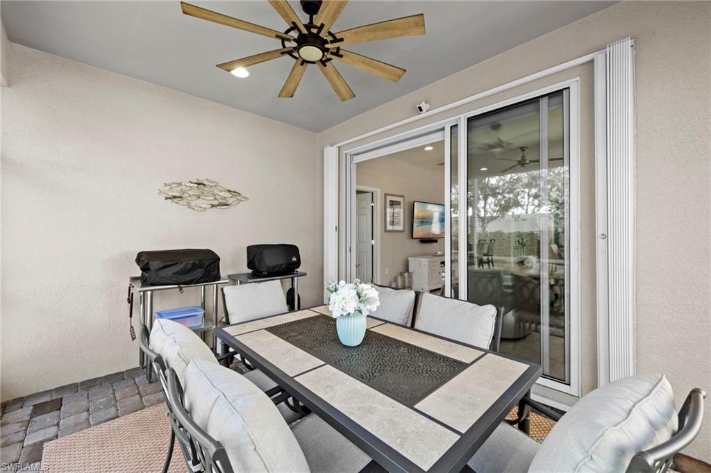 20179 Torch Key Way Estero, FL 33928 - Photo 28 of 41 a view of a dining room with furniture window and outside view
