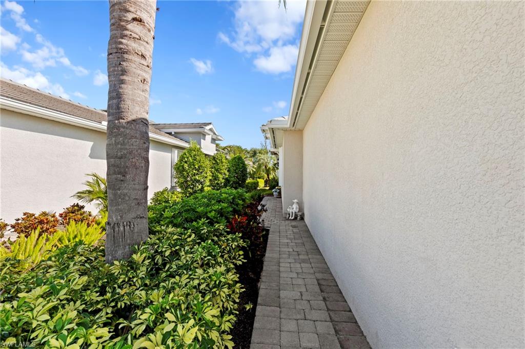 20179 Torch Key Way Estero, FL 33928 - Photo 31 of 41 a view of a pathway with outside of the house