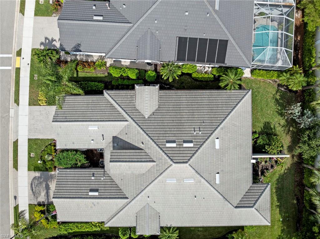 20179 Torch Key Way Estero, FL 33928 - Photo 33 of 41 an aerial view of a house with a yard and potted plants