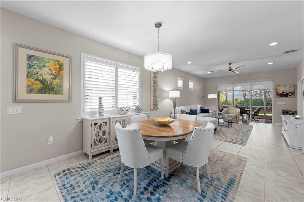 20179 Torch Key Way Estero, FL 33928 - Photo 6 of 41 a view of a dining room with furniture