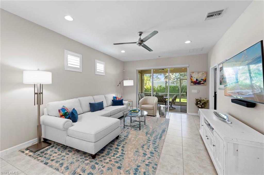 20179 Torch Key Way Estero, FL 33928 - Photo 8 of 41 a living room with furniture and a large window
