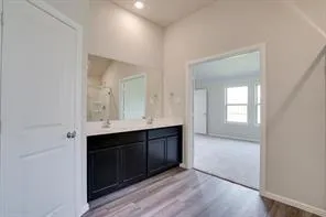 wooden floor with cabinet in a room