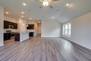 a view of kitchen with sink and wooden floor