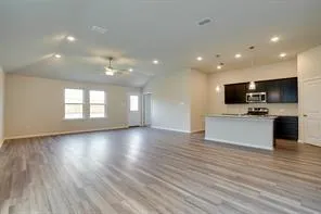 a view of kitchen with cabinets and wooden floor