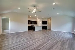 a view of a kitchen with a sink and a stove top oven