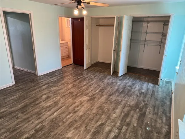 a bathroom with a sink vanity and mirror