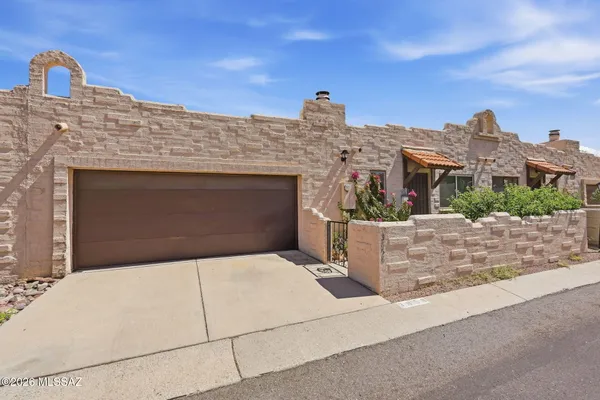 a front view of a house with a garage