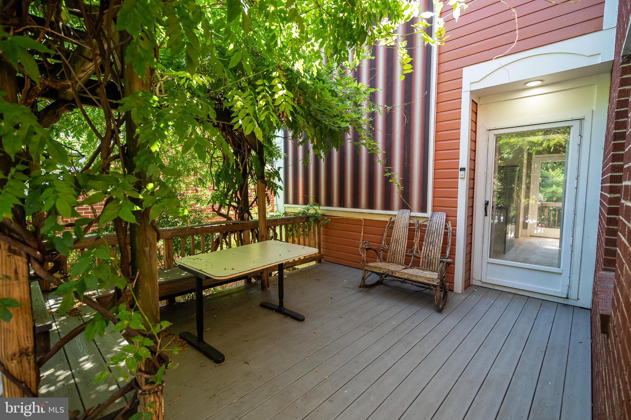 241 Edwards Ferry Road Northeast Leesburg, VA 20176 - Photo 5 of 27 Charming patio with lush greenery.