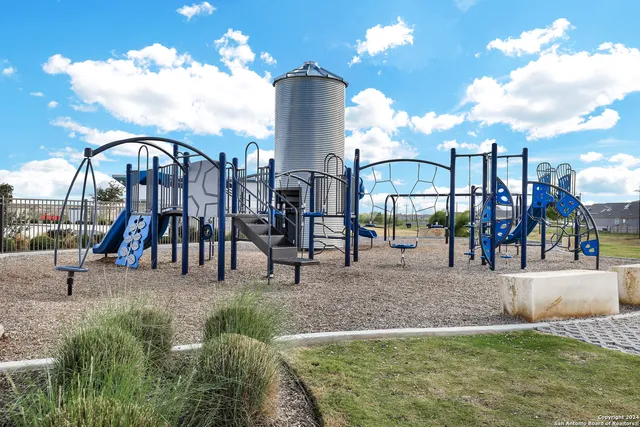 a building outdoor space with patio furniture and garden view