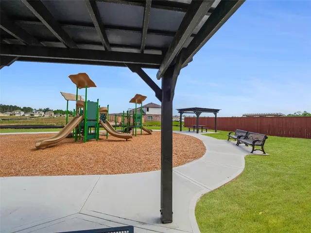 a view of a swimming pool with a yard