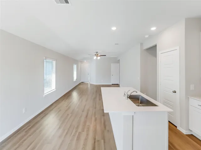 a view of kitchen and wooden floor