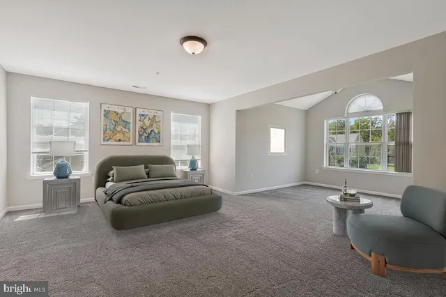 a view of a livingroom with furniture and windows