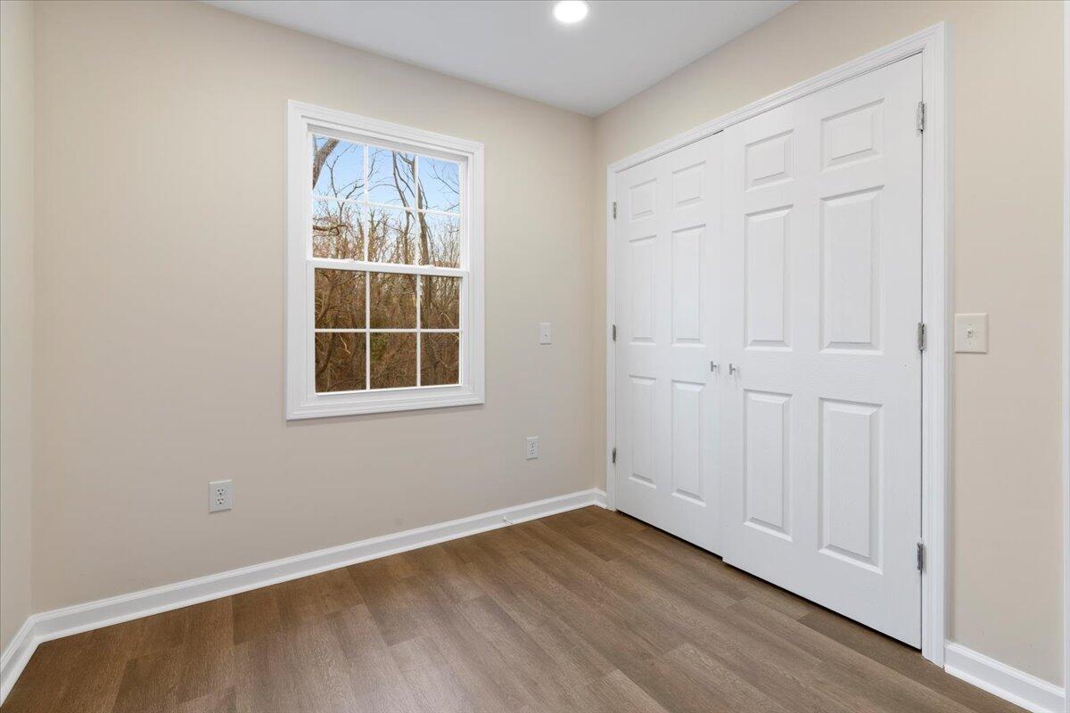 127 State Pulaski, VA 24301 - Photo 23 of 35 an empty room with wooden floor and windows
