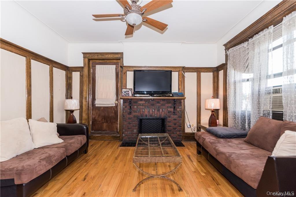 36 Echo Avenue, Unit 5C New Rochelle, NY 10801 - Photo 2 of 18 a living room with furniture and a fireplace