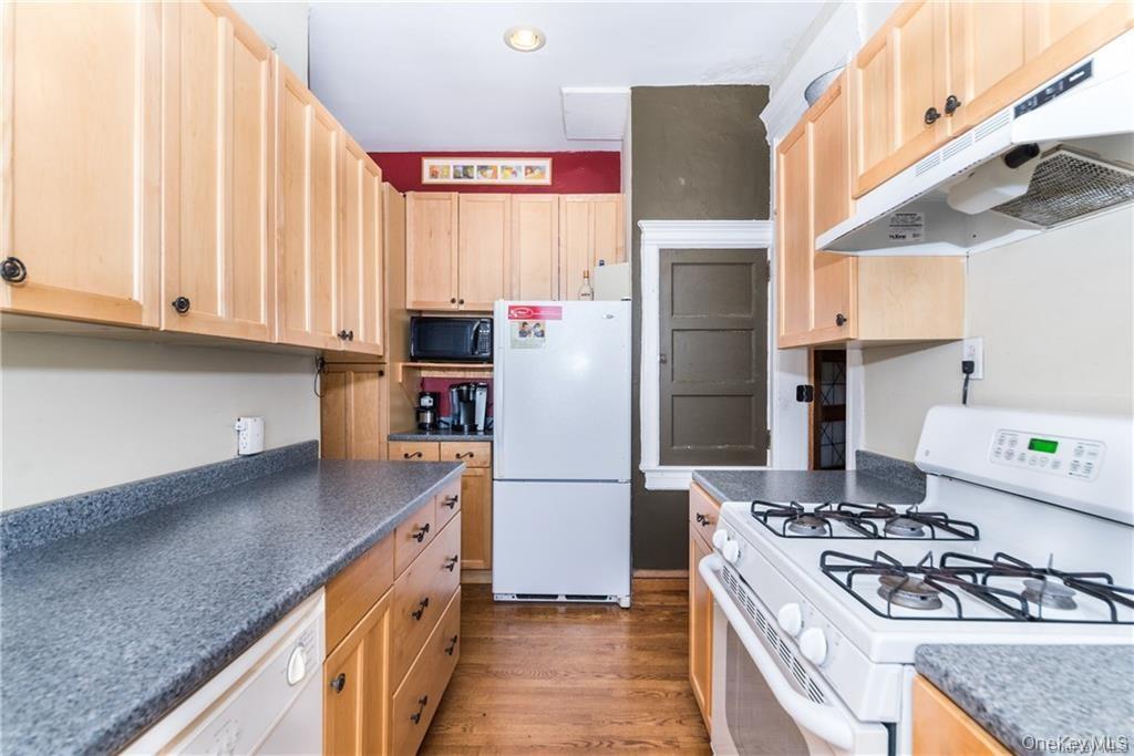 36 Echo Avenue, Unit 5C New Rochelle, NY 10801 - Photo 8 of 18 a kitchen with stainless steel appliances granite countertop a refrigerator a stove and a sink