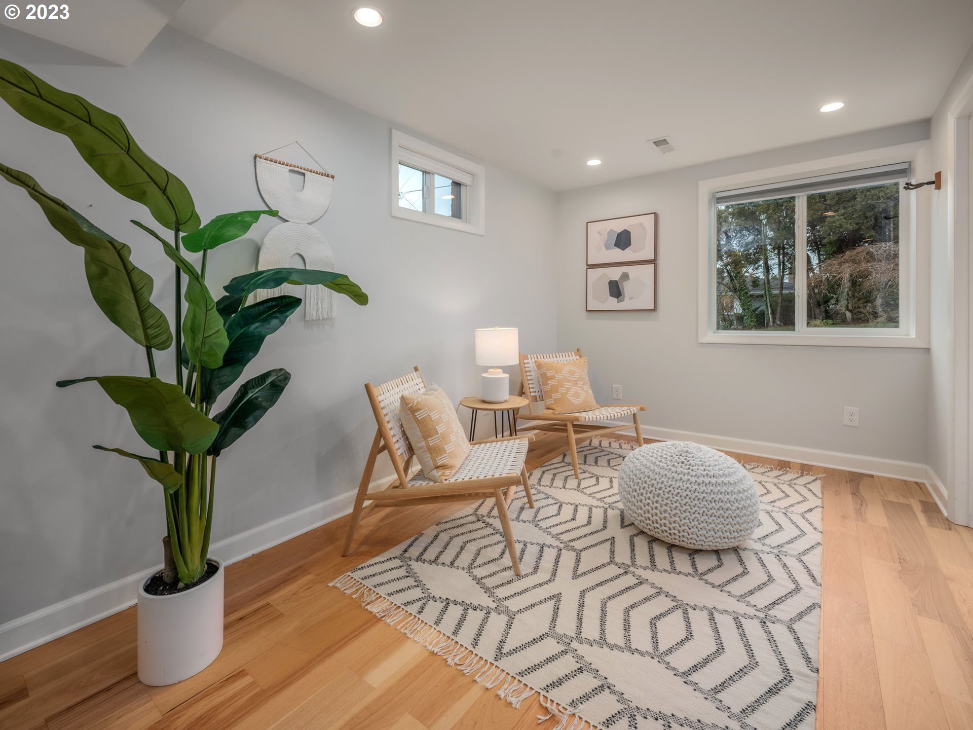 10303 Southeast Stephens Street Portland, OR 97216 - Photo 14 of 32 a living room with furniture potted plant and wooden floor