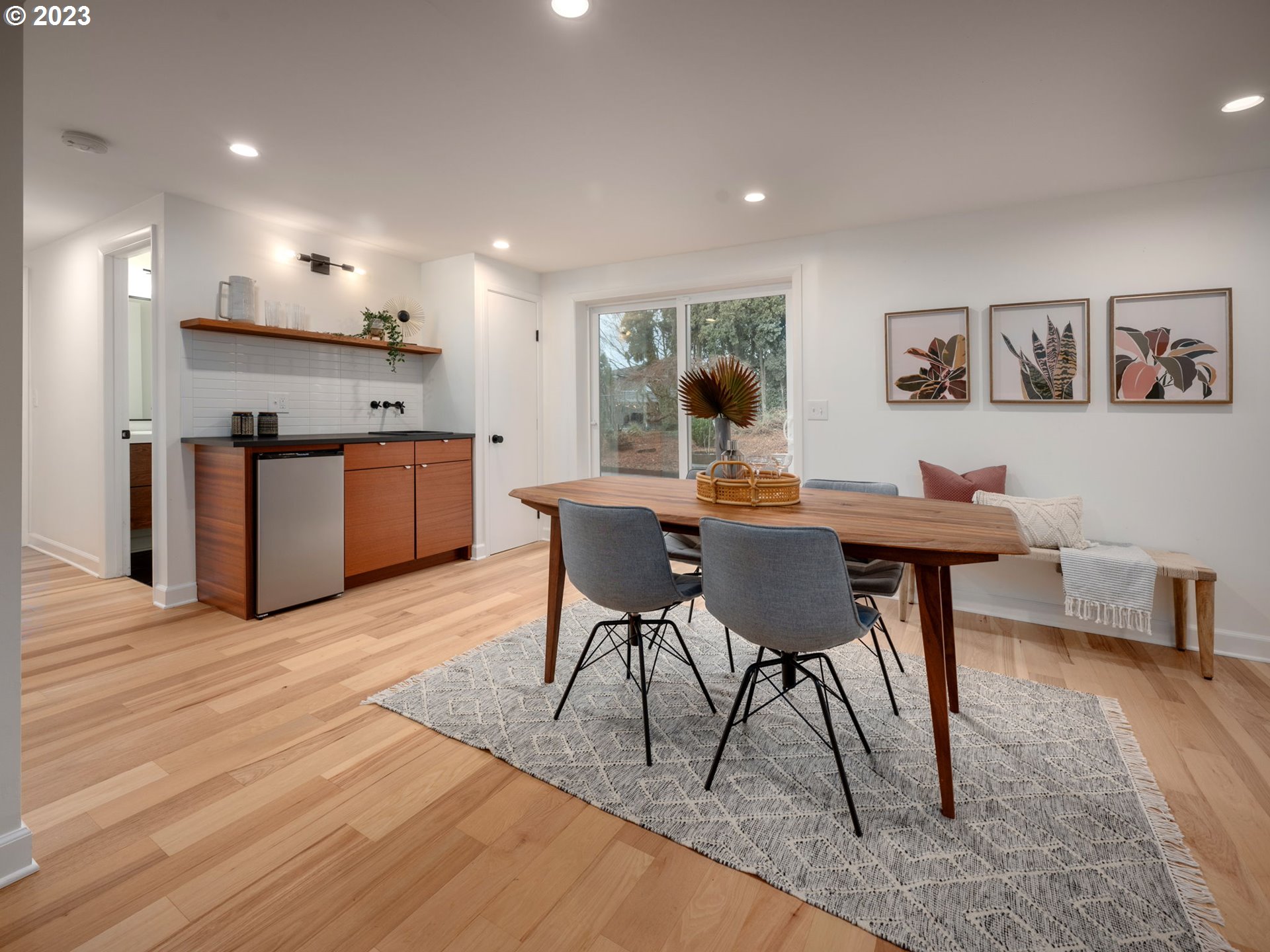 10303 Southeast Stephens Street Portland, OR 97216 - Photo 19 of 32 a view of a dining room with furniture and wooden floor