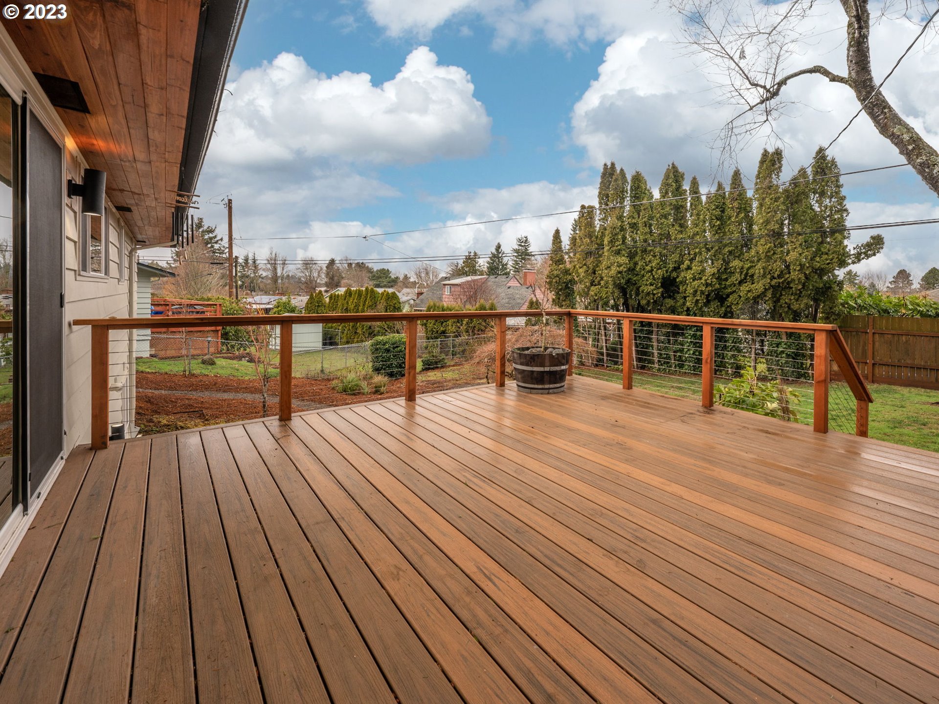 10303 Southeast Stephens Street Portland, OR 97216 - Photo 21 of 32 a view of terrace with wooden floor and seating space