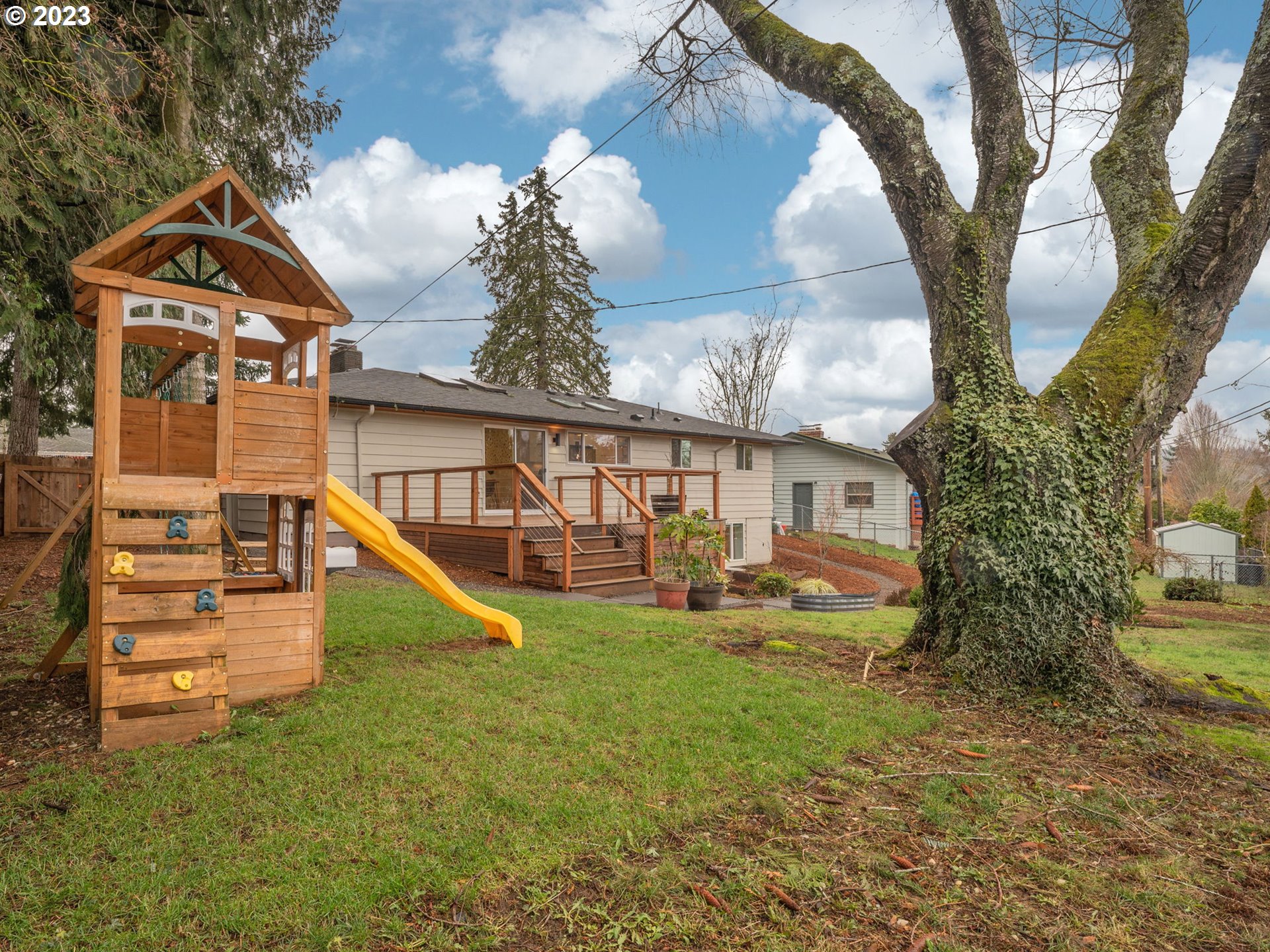 10303 Southeast Stephens Street Portland, OR 97216 - Photo 22 of 32 a view of a house with a yard