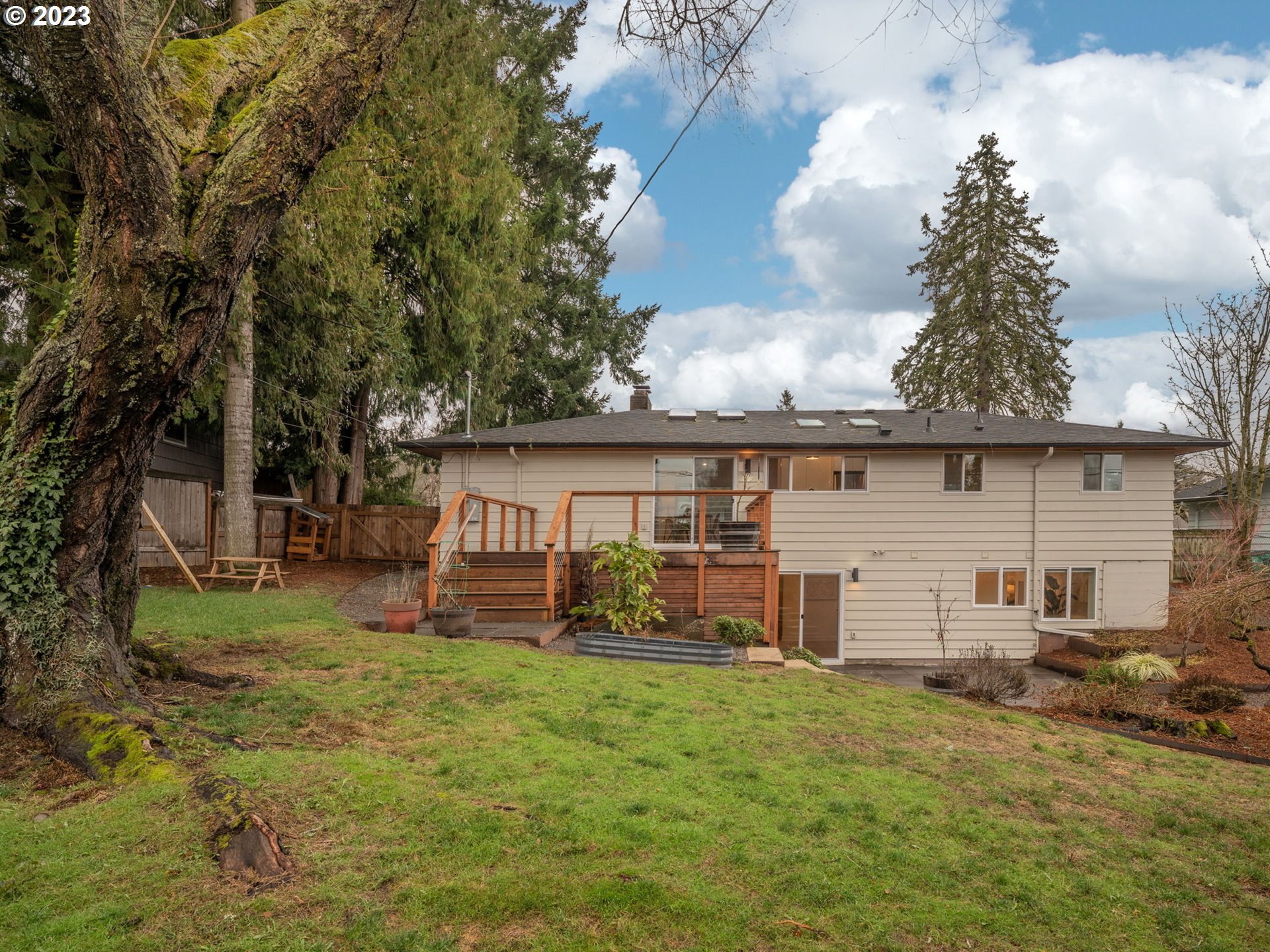 10303 Southeast Stephens Street Portland, OR 97216 - Photo 23 of 32 a view of a house with a yard